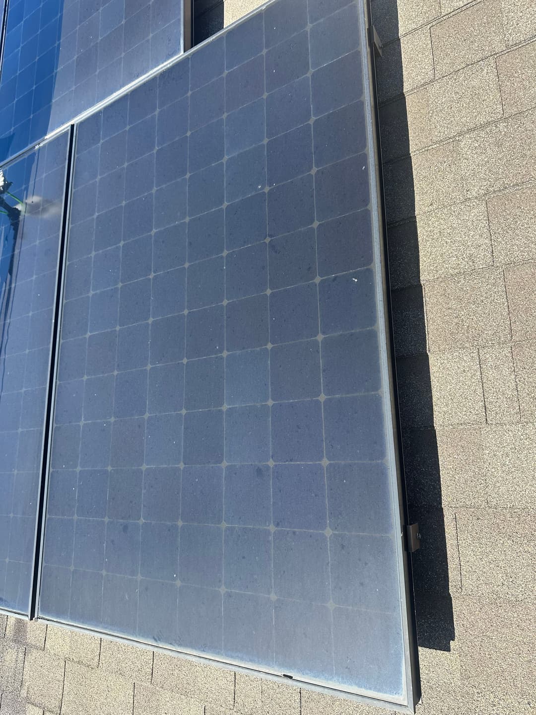 Solar panels installed on a rooftop, showcasing clean energy technology and sustainability.