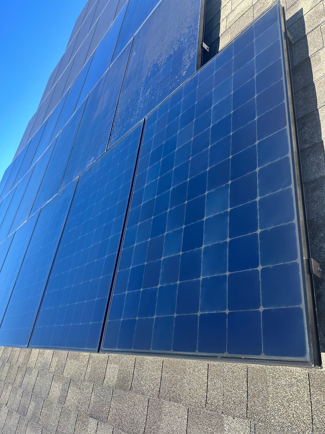 Solar panels installed on a roof, capturing sunlight for renewable energy generation.